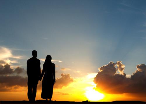 Muslim couple, sunset